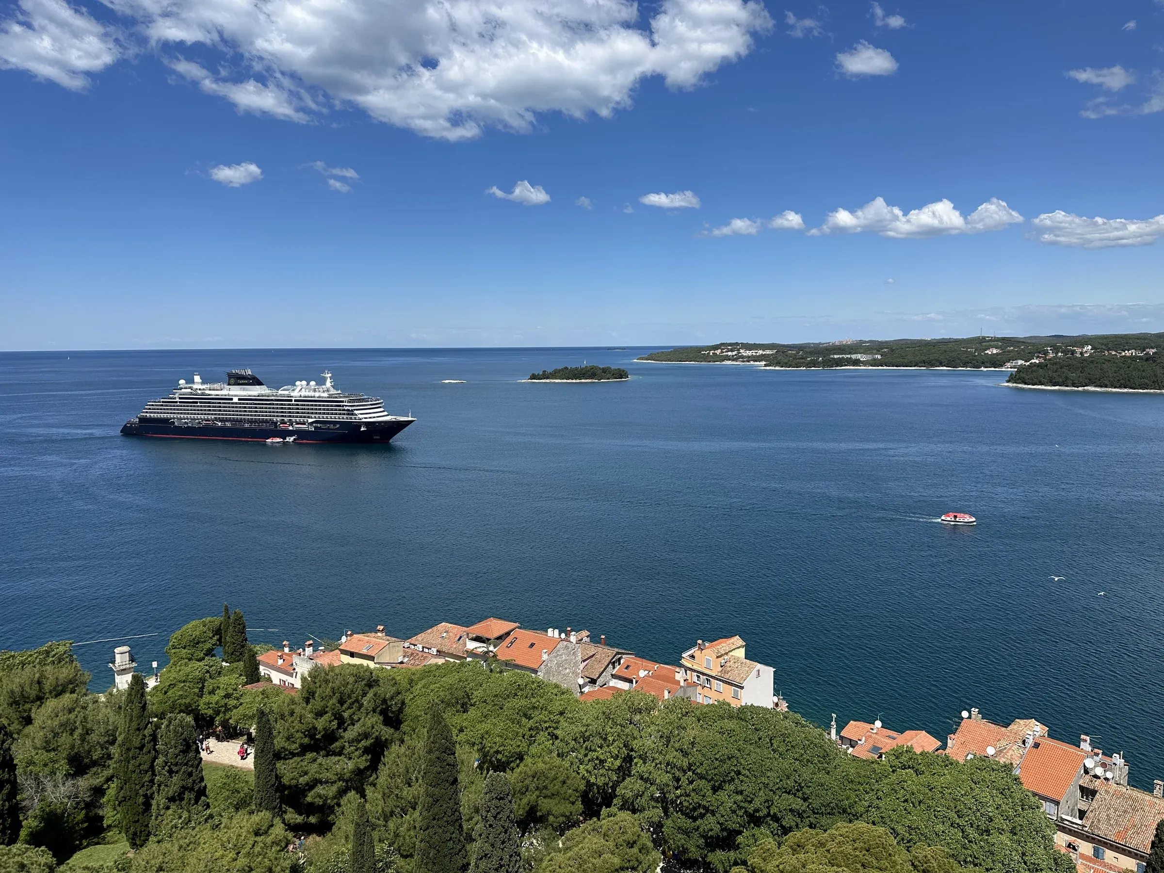 Explora I anchored off the old town of Rovinj, Croatia, seen from deck