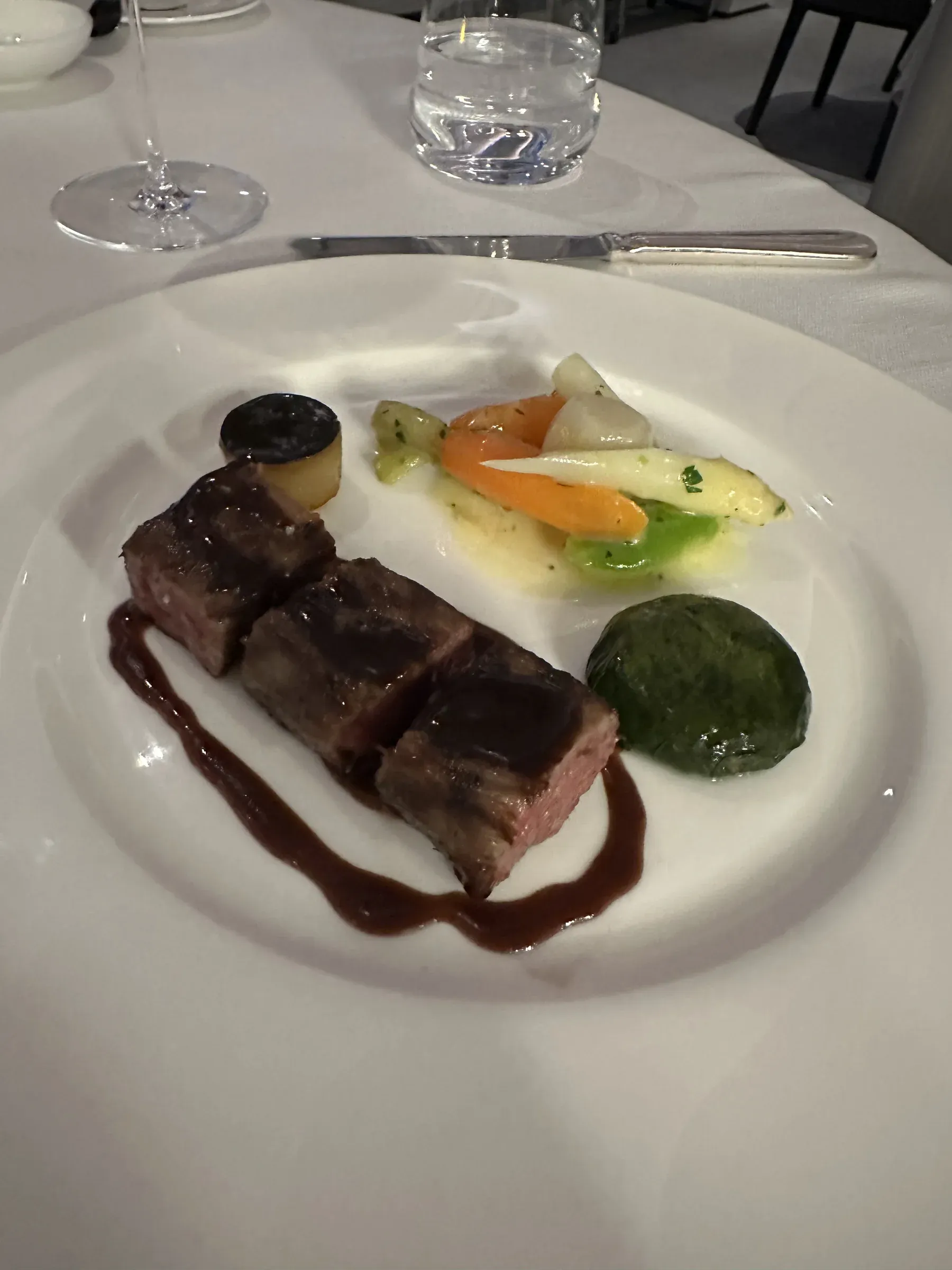 A plated main course at dinner aboard Explora I