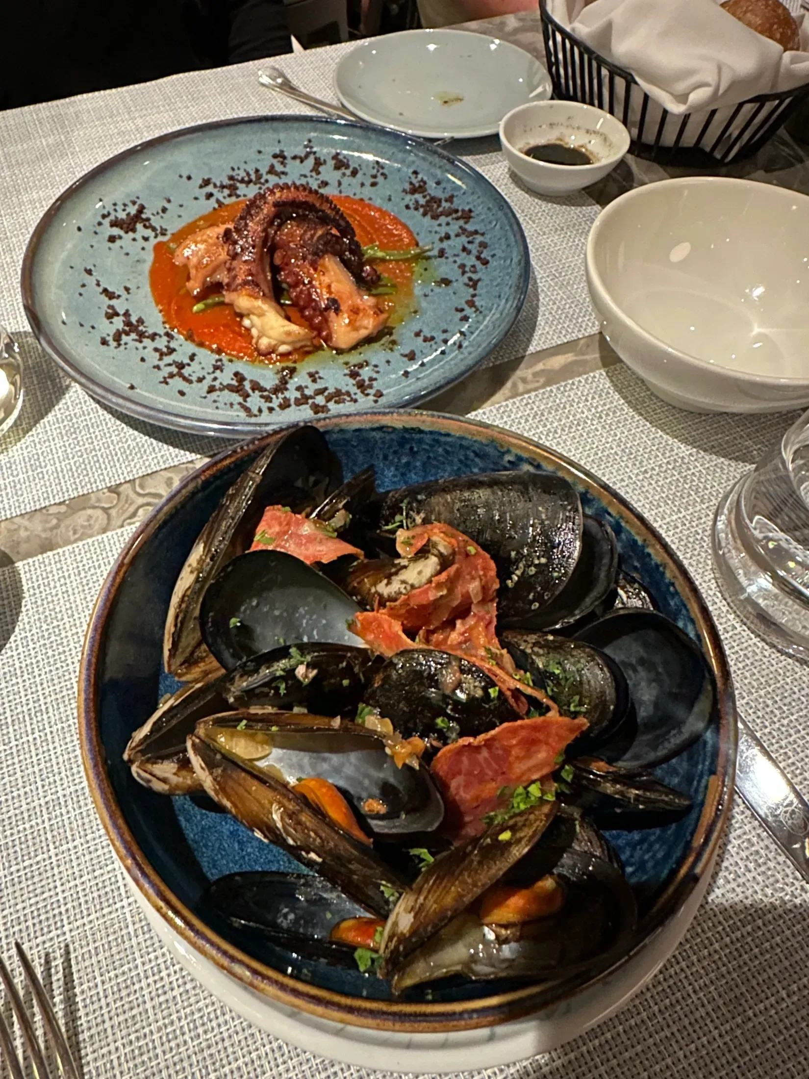 Grilled octopus and a bowl of mussels at dinner on my Explora sailing