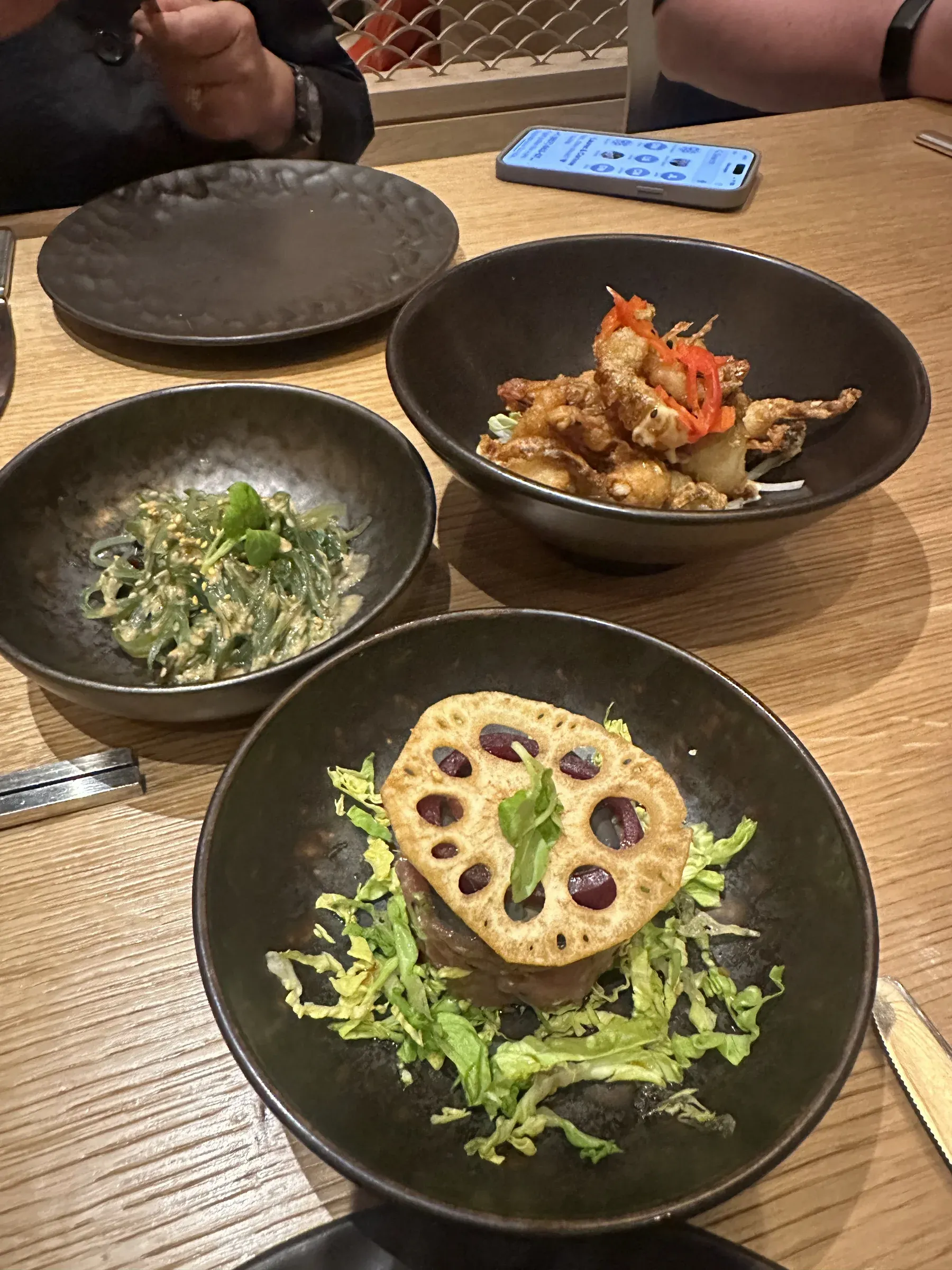 Three small plates seen from above at dinner aboard Explora I