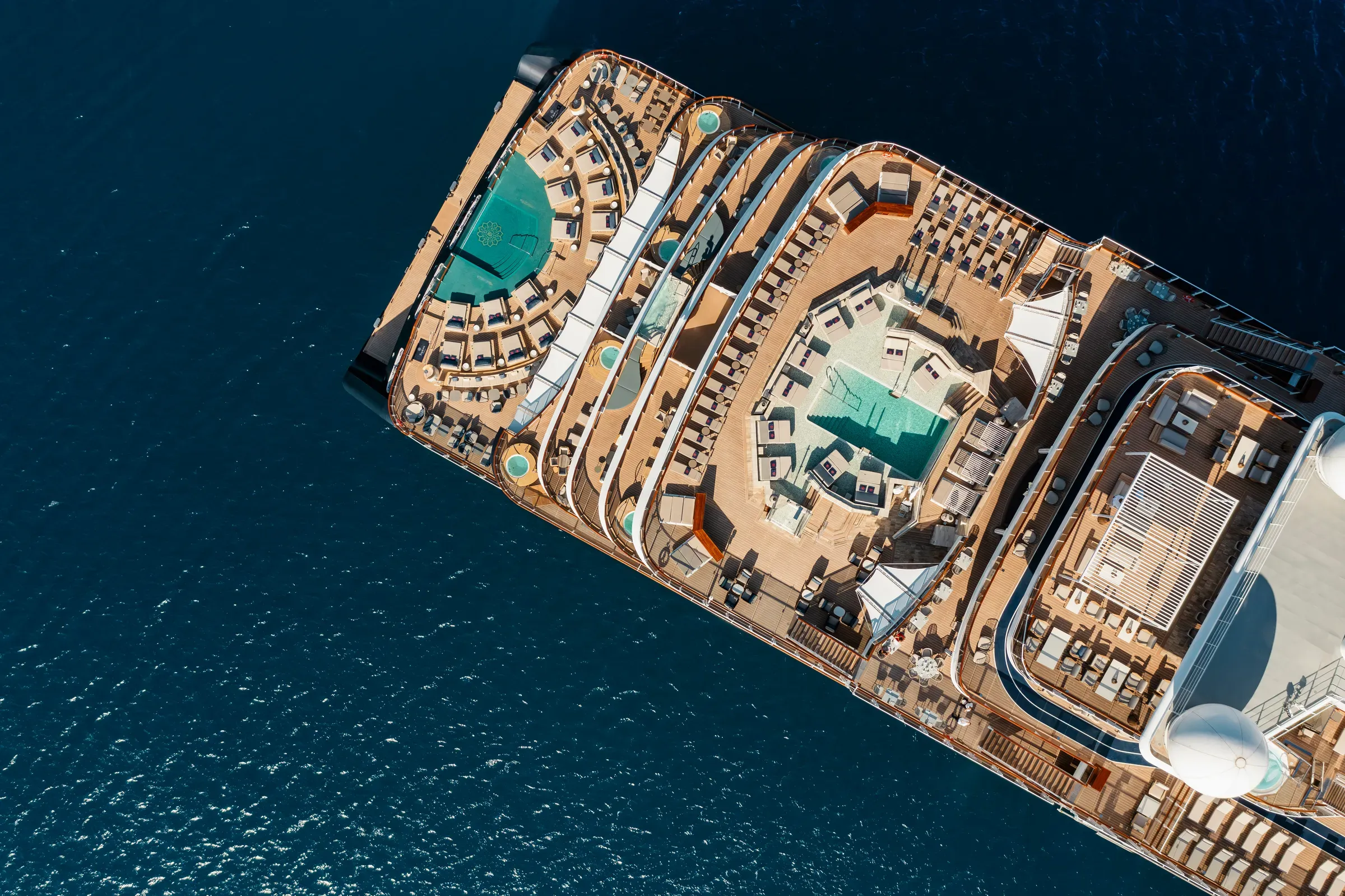 An Explora Journeys ship seen from above, sailing the Aegean off Paros, Greece